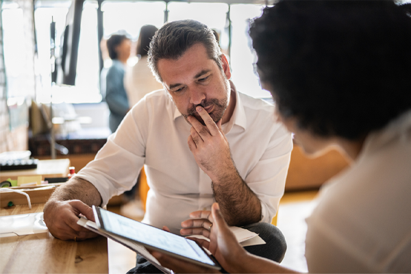 Man looking at screen with woman