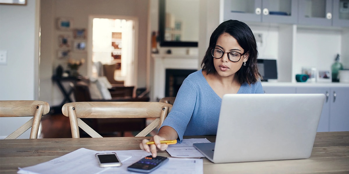 employee working on laptop at desk