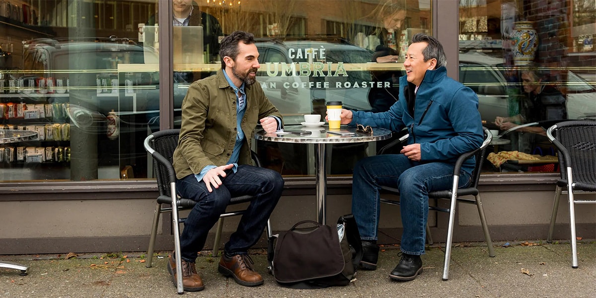 two people sitting at cafe