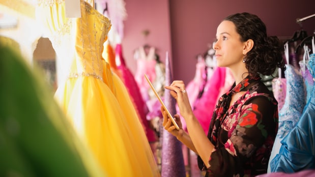 Woman working in a dress store