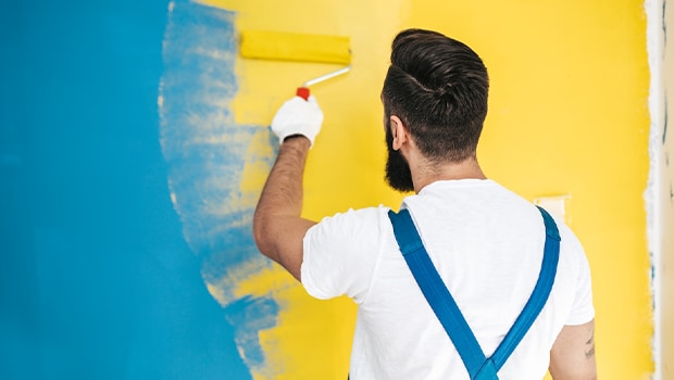 Man painting wall