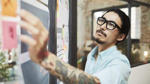 man working on whiteboard