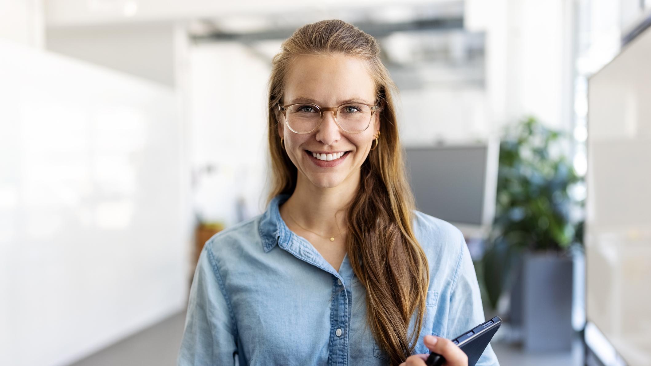 woman smiling with tablet