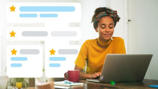 woman looking at computer with icons around