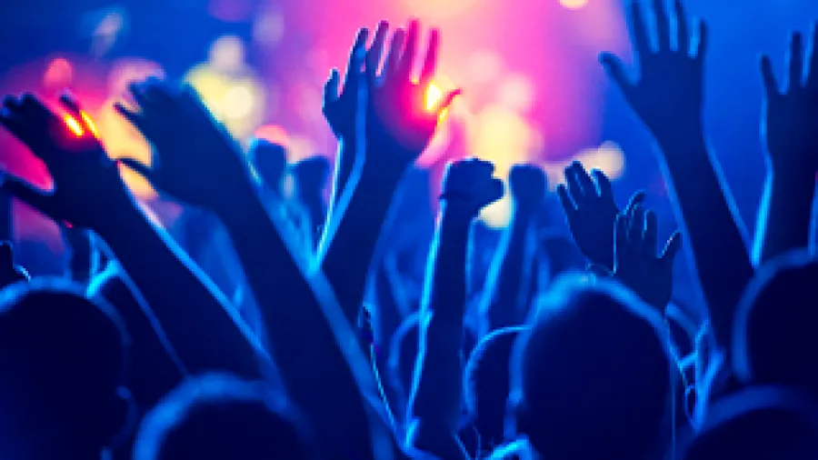 Hands reaching up in a crowd