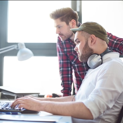 two people working on a computer
