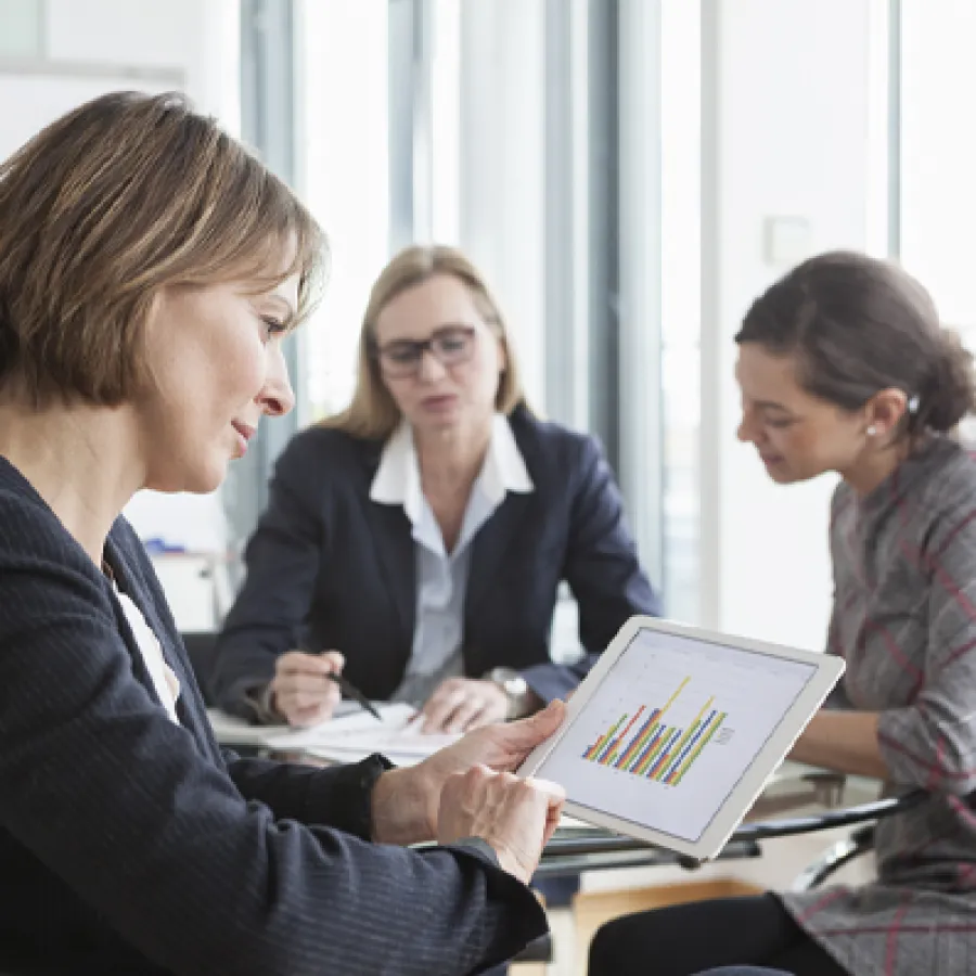 Woman looking at data on a tablet