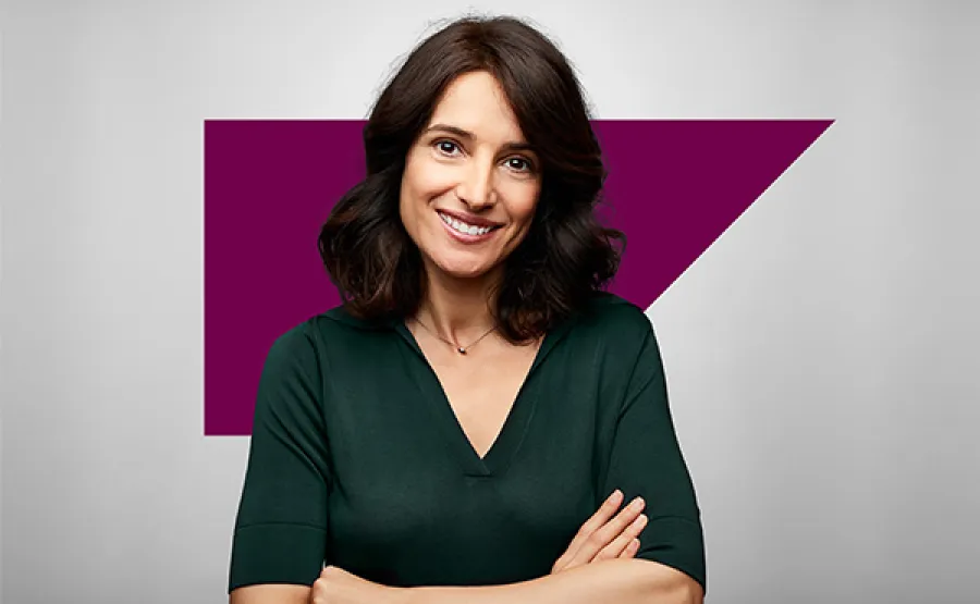 smiling woman with arms crossed