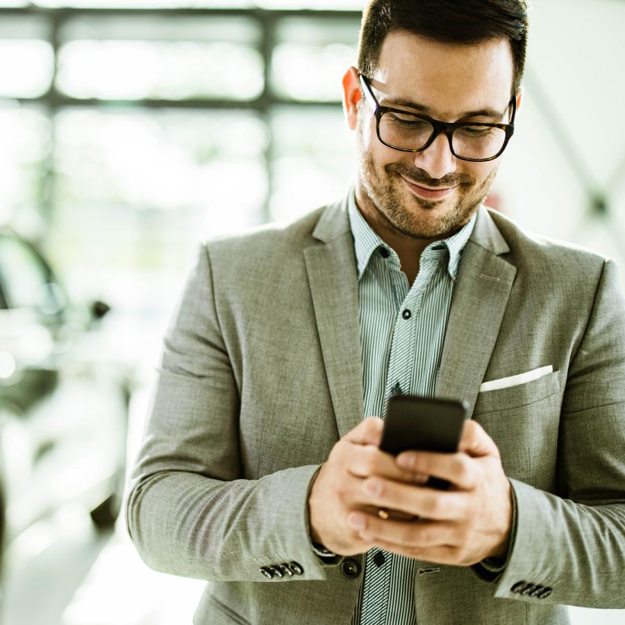 man using app on his phone for travel