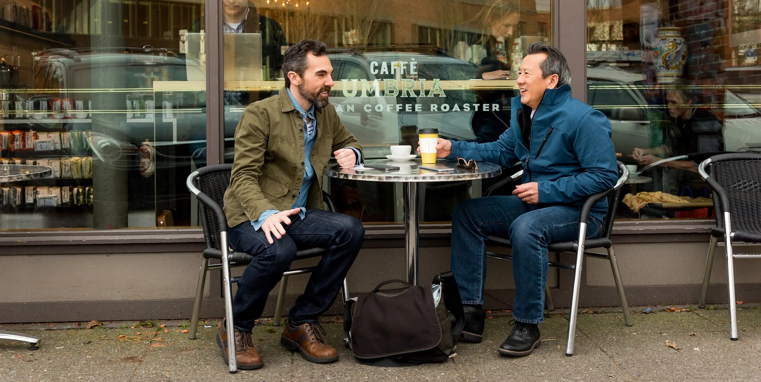 two people sitting at cafe