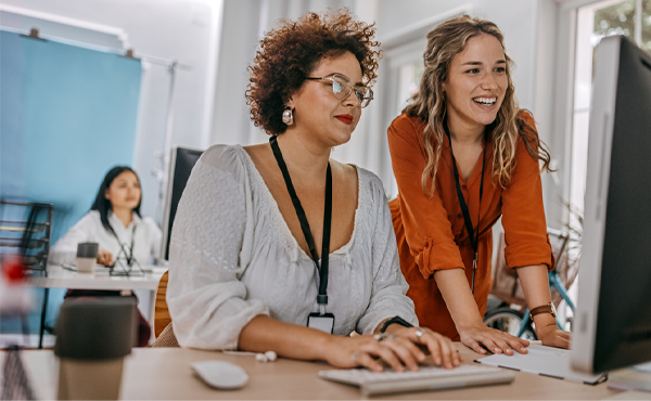 Two women working at a computer