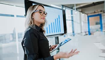 woman in front of bar graph