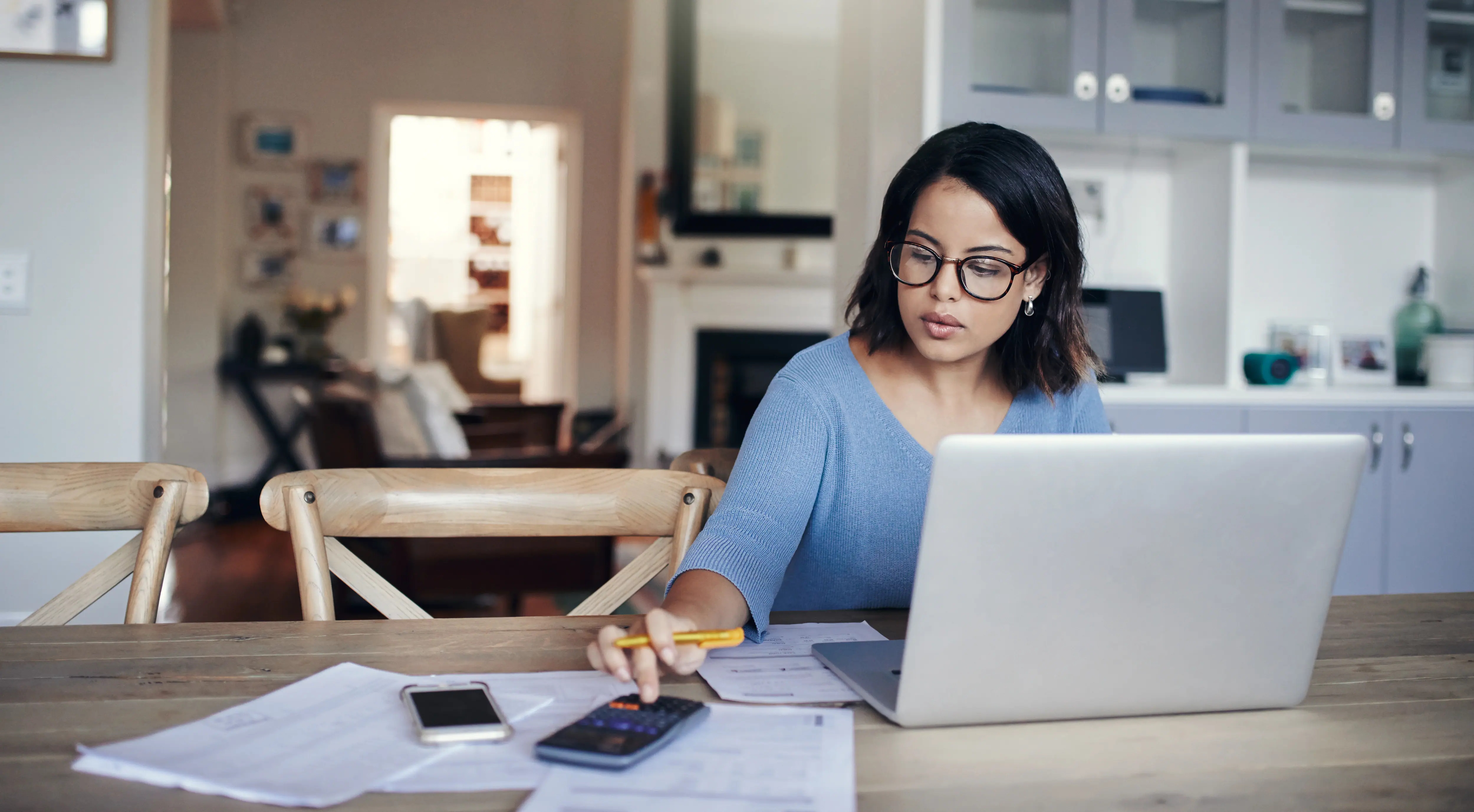 employee working on laptop at desk