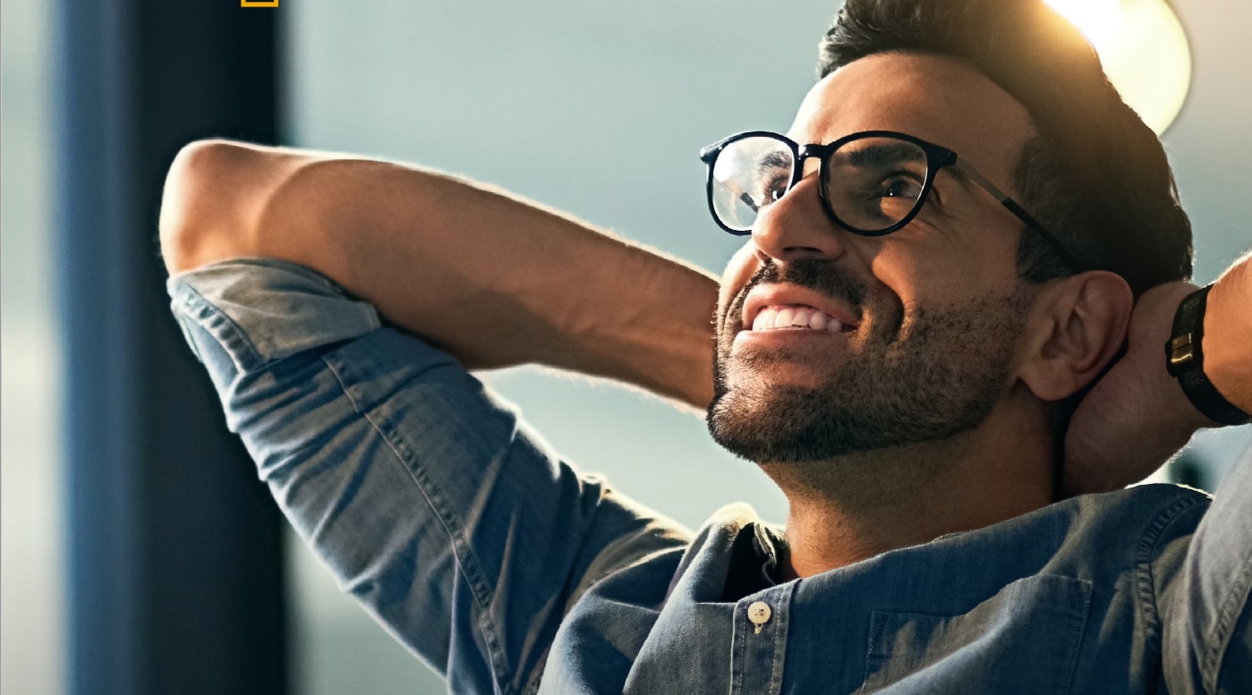 man leaning back on chair