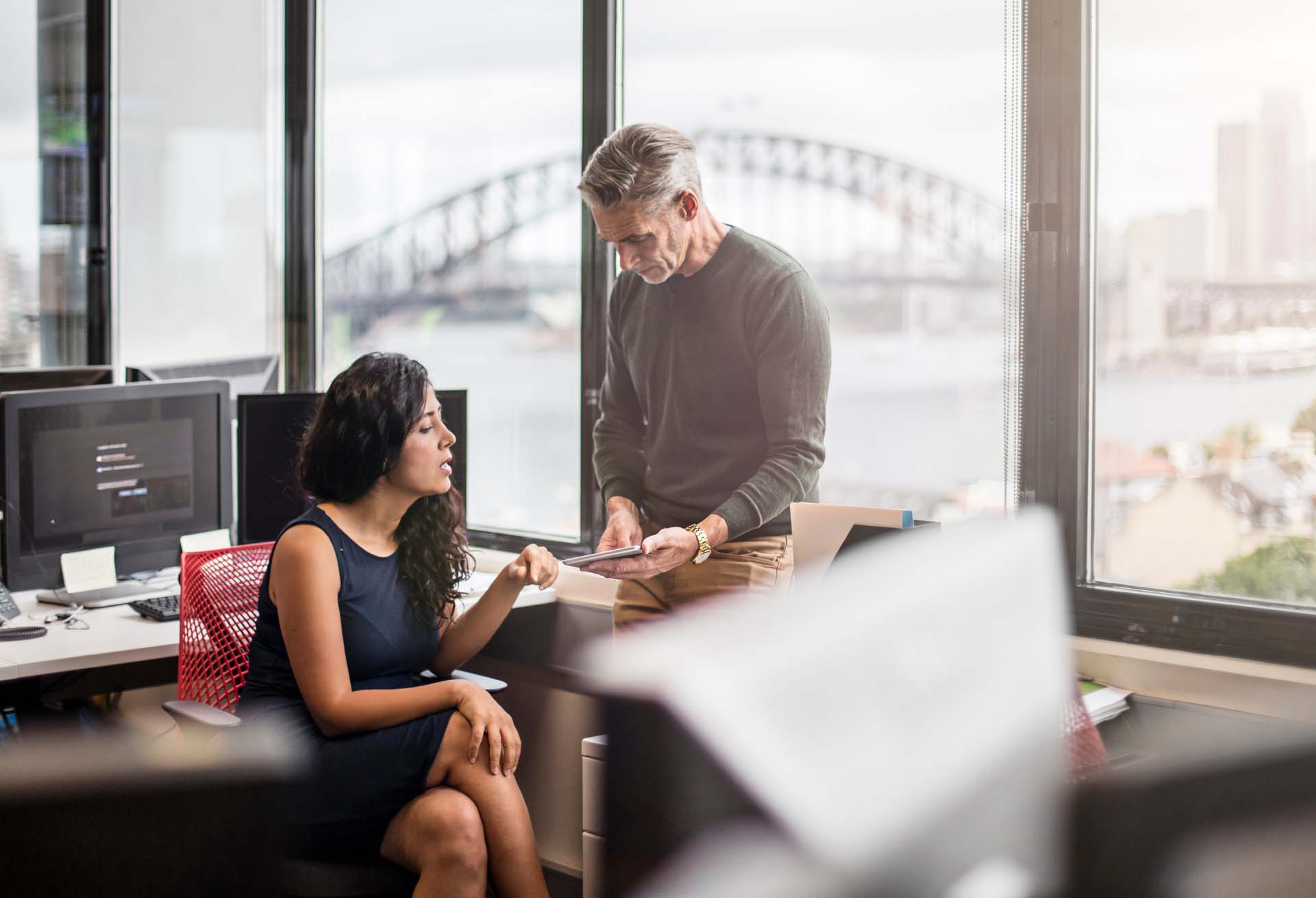 woman and man using our expense process checklist in an Australian office