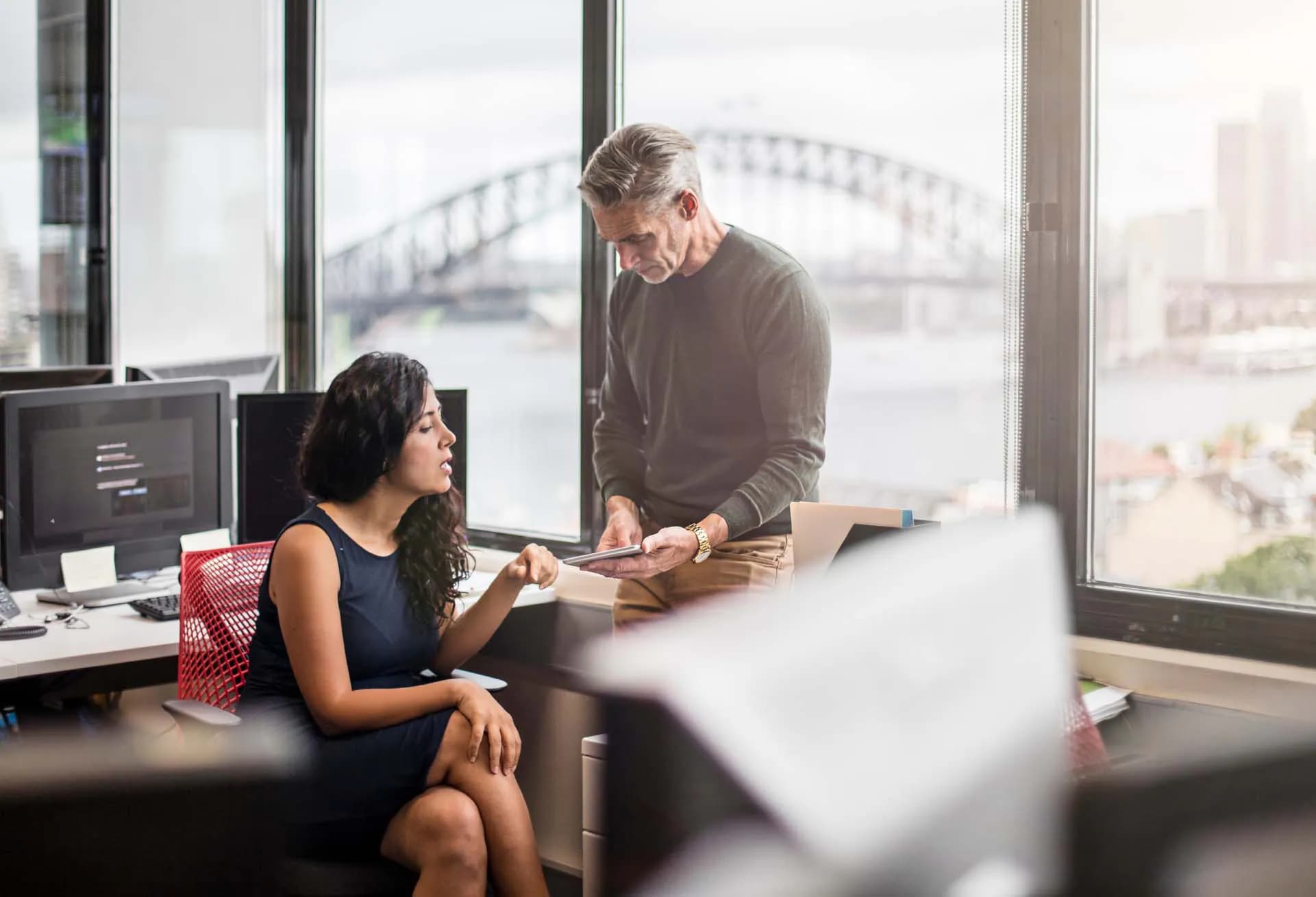 woman and man using our expense process checklist in an Australian office